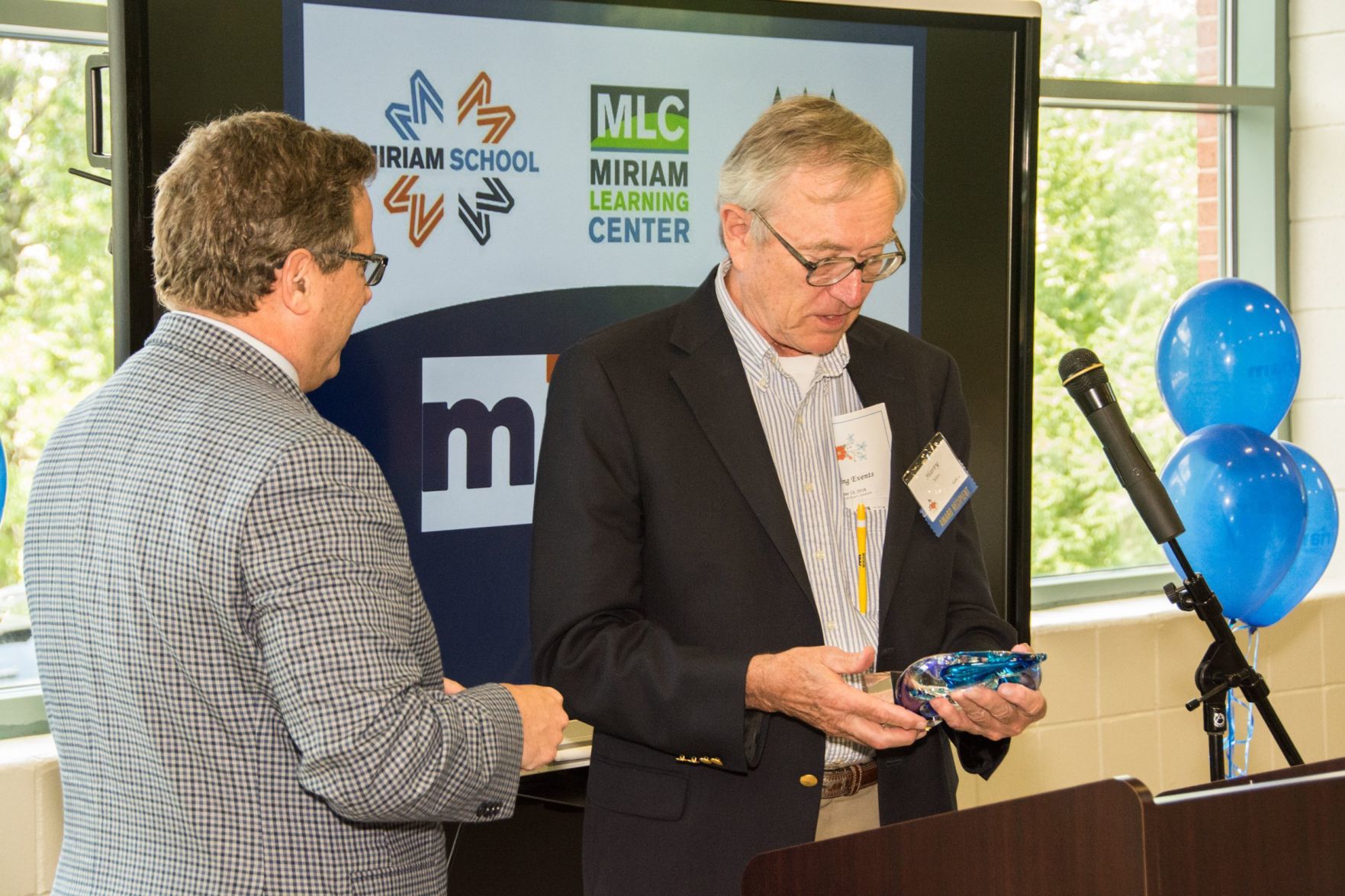Andy Thorp, Executive Director of Miriam School presents an award to Harry Witte at the Friends of Miriam Luncheon